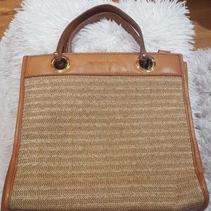 Medallion leather and straw handbag